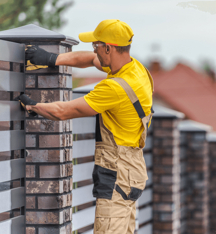 Stag Fencing specialist building a brick pier fence